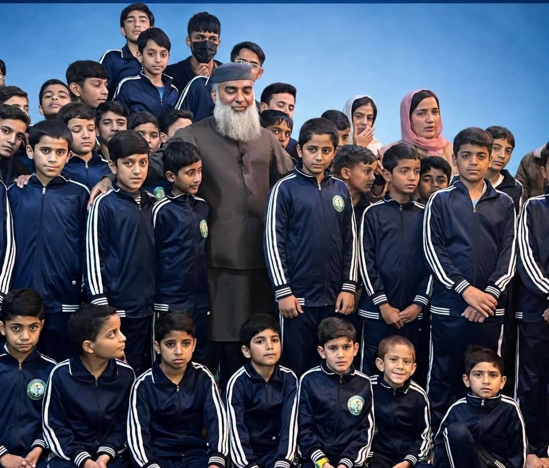 Dozens of children in matching navy tracksuits gathered for a group photograph with an elder of the foundation.