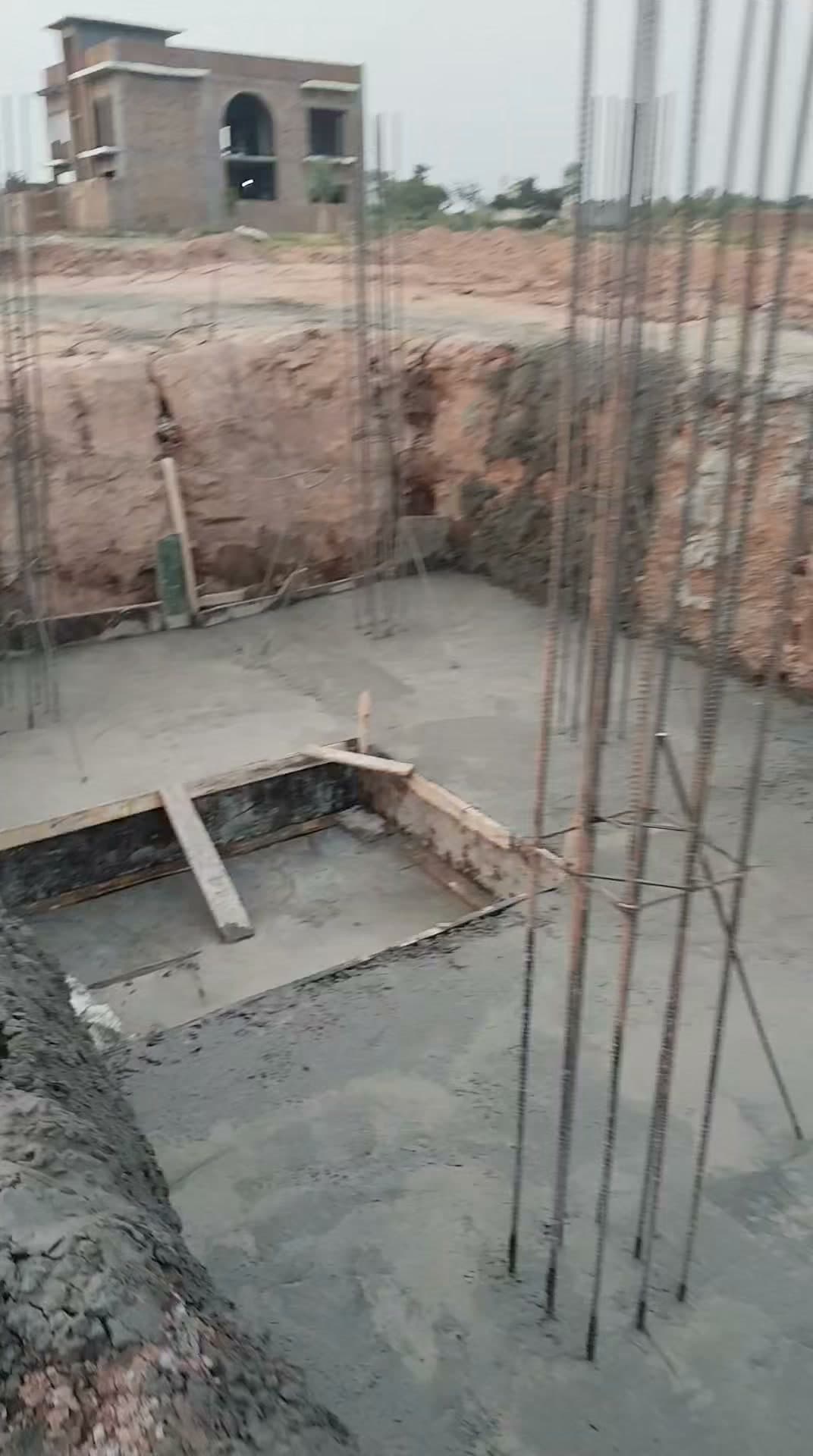 The Parsa Home site in Islamabad: foundations poured, steel reinforcement standing ready for the next stage.