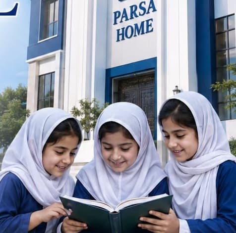 Three girls in school uniform reading a book together outside Parsa Home.